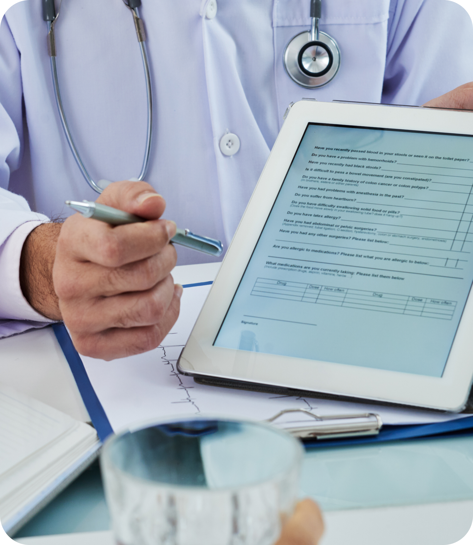 Physician reviewing a patient intake form on a tablet